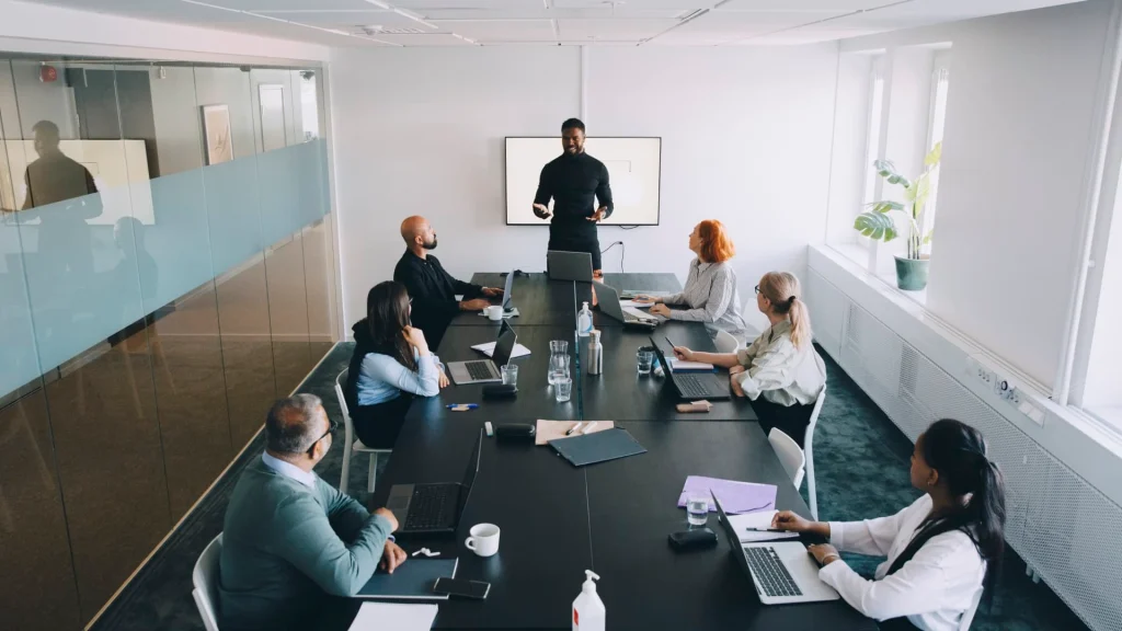 A diverse team discussing the future of artificial intelligence and technology in the modern workplace.